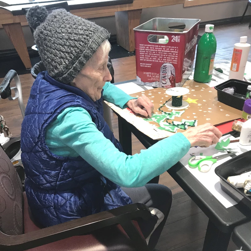 A senior lady doing art