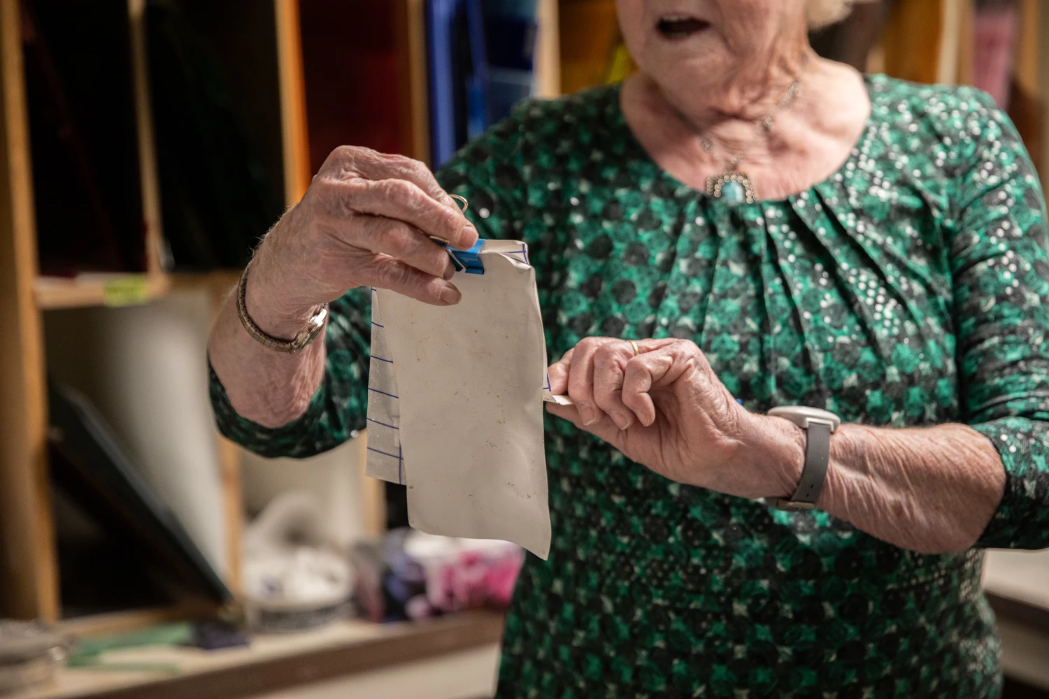 Nel holding a piece of paper