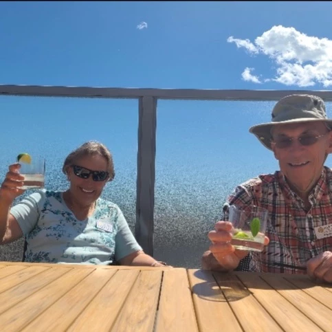 A couple sitting together and cheering each other