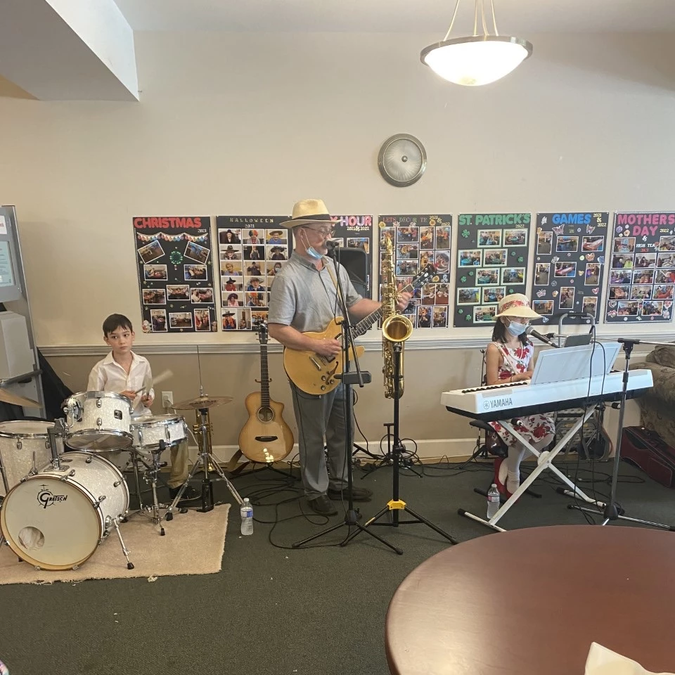 A man singing and playing guitar