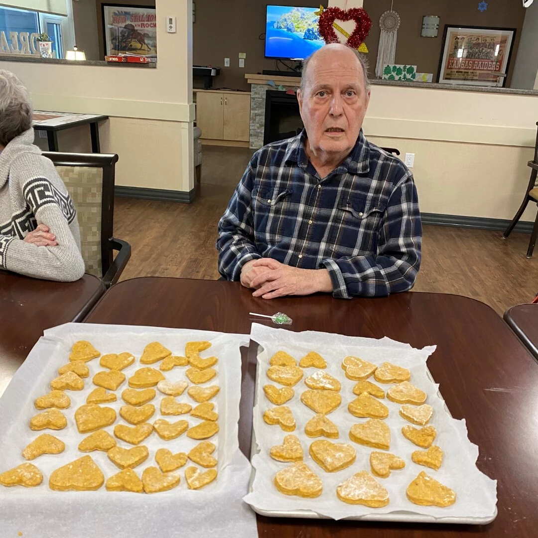 People celebrating month of love with heart-shaped cookies