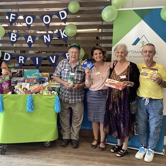 Residents celebrating the food bank drive at Aster Gardens